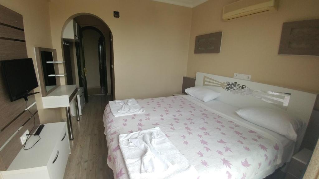 Postel nebo postele na pokoji v ubytování Bellamaritimo Hotel