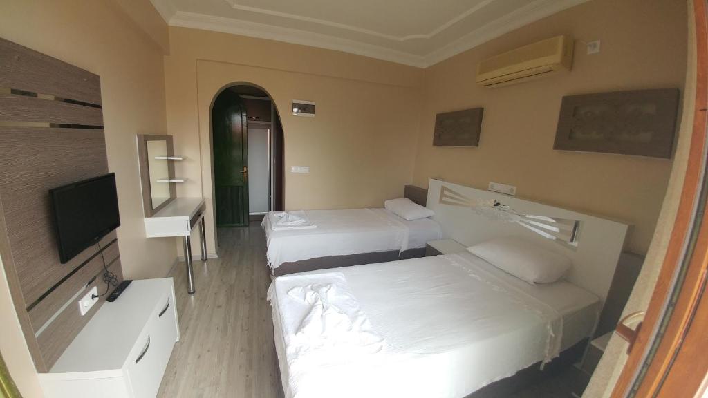 TV a/nebo společenská místnost v ubytování Bellamaritimo Hotel
