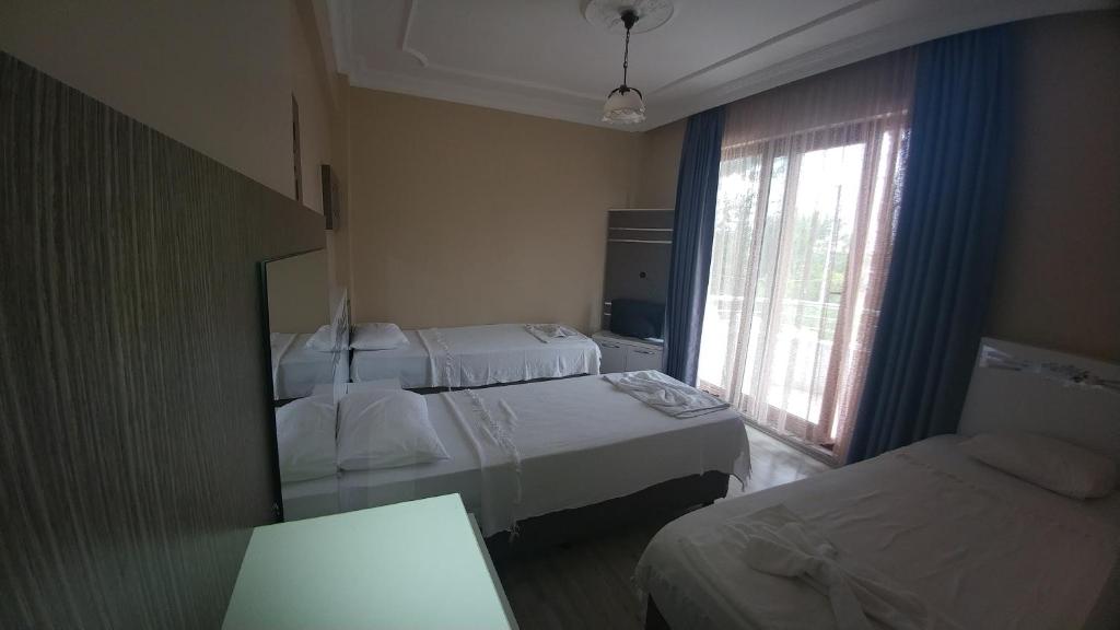 Postel nebo postele na pokoji v ubytování Bellamaritimo Hotel