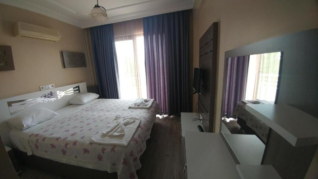 Postel nebo postele na pokoji v ubytování Bellamaritimo Hotel