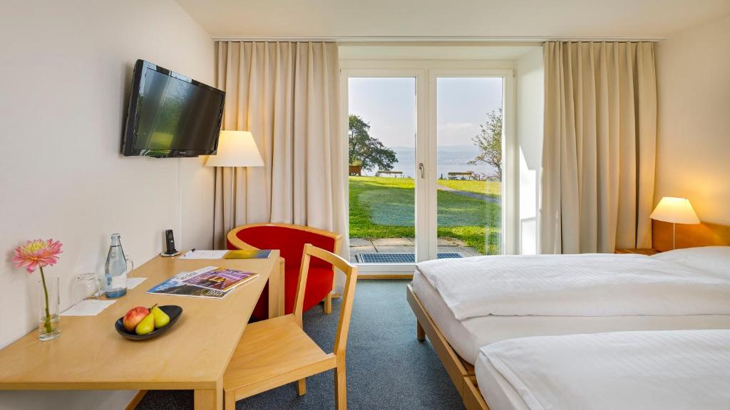 Postel nebo postele na pokoji v ubytování Hotel Boldern