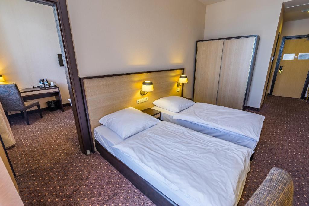 Postel nebo postele na pokoji v ubytování Hotel Lomsia