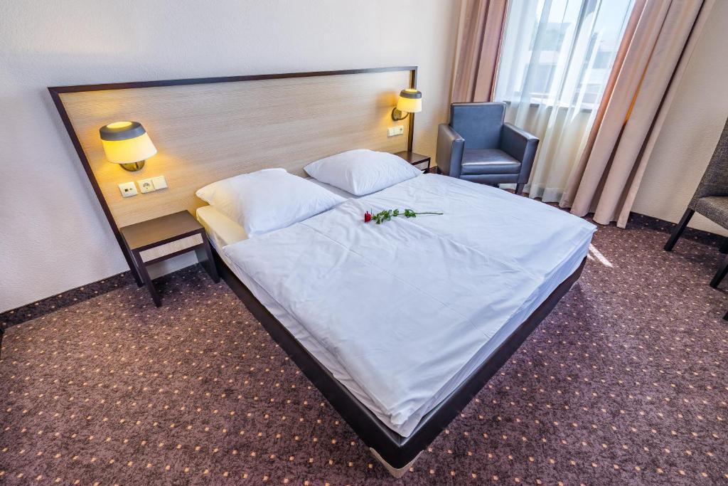 Voodi või voodid majutusasutuse Hotel Lomsia toas