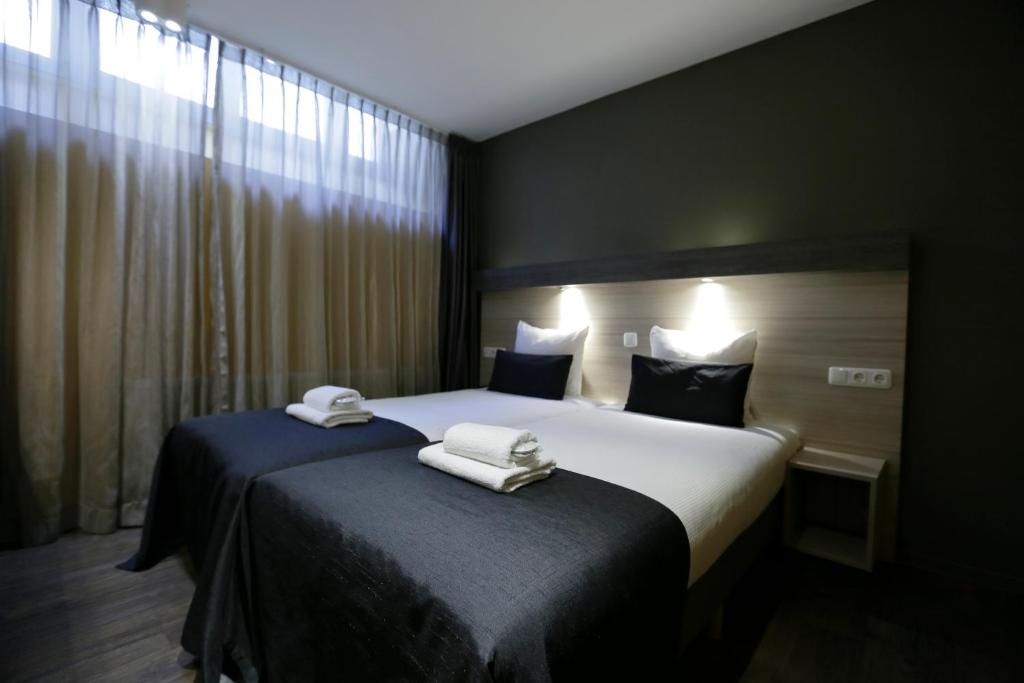 Postel nebo postele na pokoji v ubytování City Hotel Amsterdam