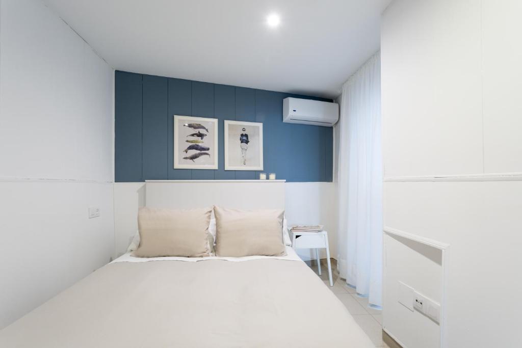 Posteľ alebo postele v izbe v ubytovaní Apartamentos Diaber Gerona 22