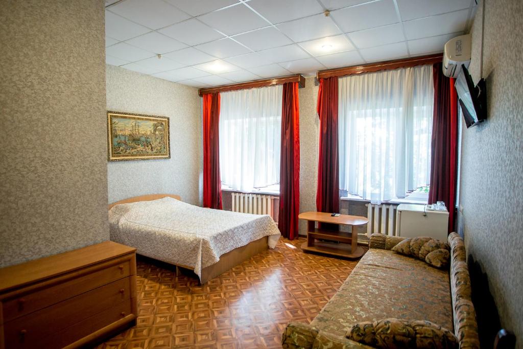 Postel nebo postele na pokoji v ubytování Premium Hotel