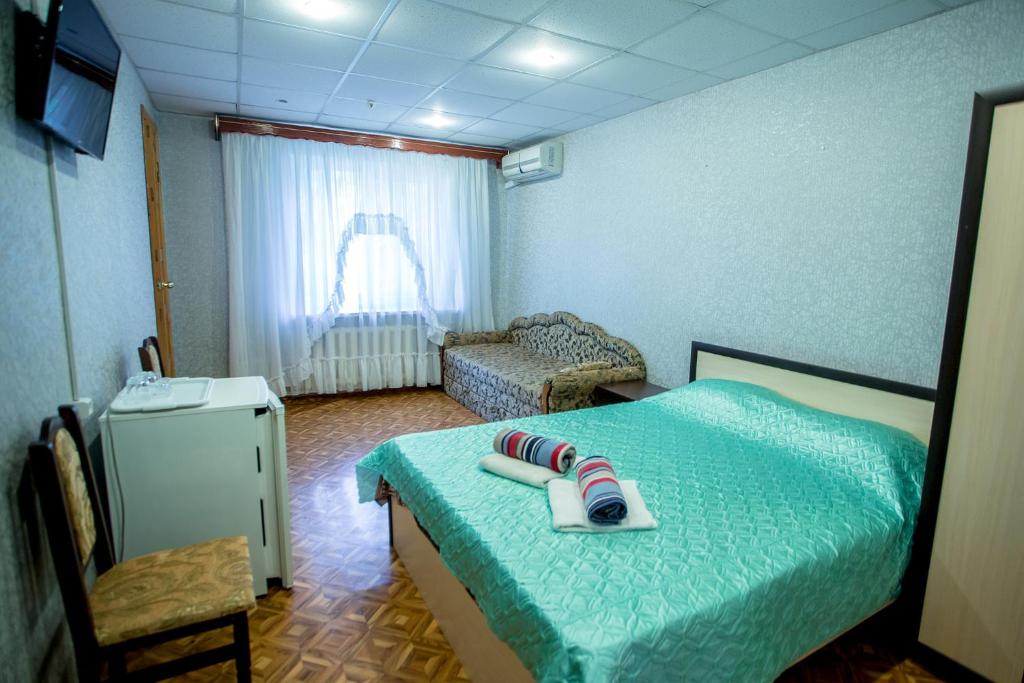 Postel nebo postele na pokoji v ubytování Premium Hotel