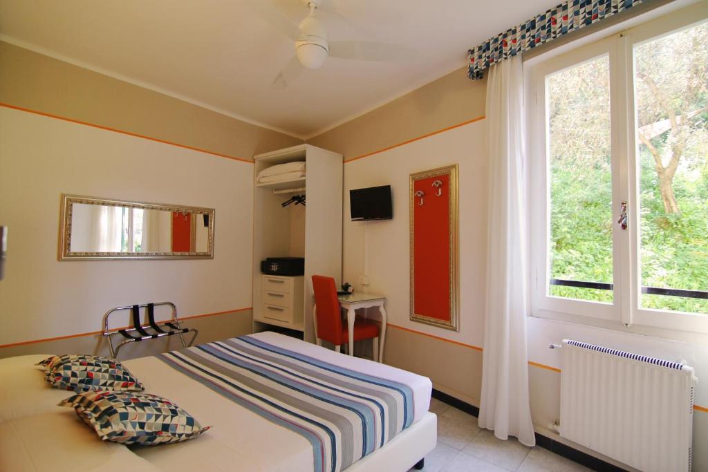 Postel nebo postele na pokoji v ubytování Hotel Souvenir
