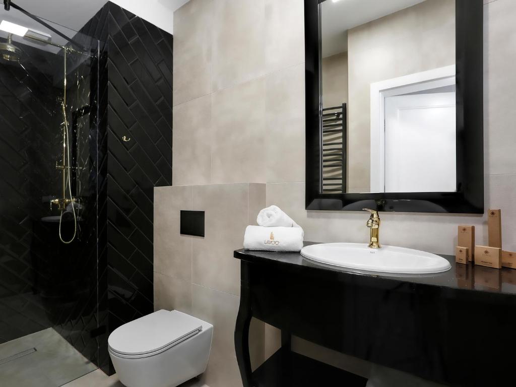 Koupelna v ubytování Lavoo Boutique Apartments