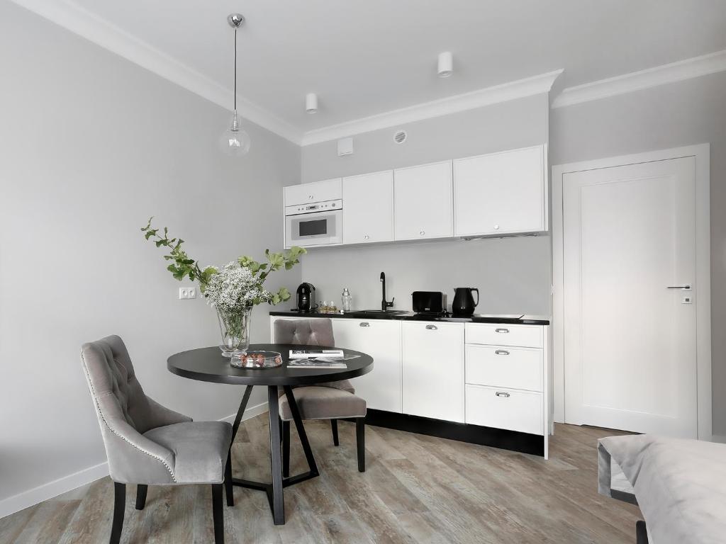 Kuchyň nebo kuchyňský kout v ubytování Lavoo Boutique Apartments