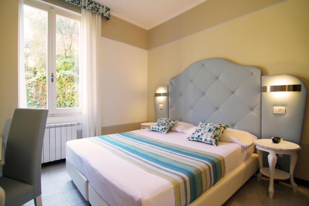 Postel nebo postele na pokoji v ubytování Hotel Souvenir