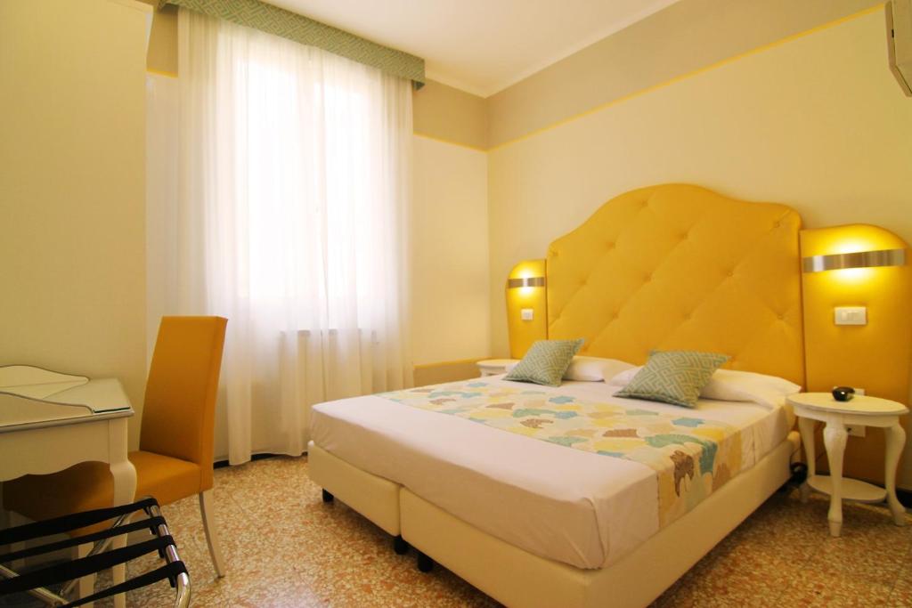 Postel nebo postele na pokoji v ubytování Hotel Souvenir