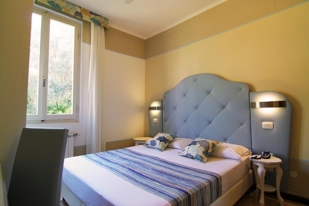 Postel nebo postele na pokoji v ubytování Hotel Souvenir