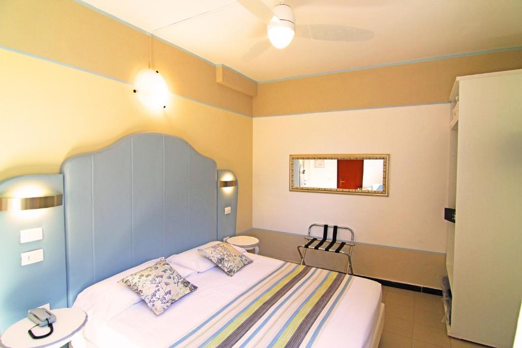 Postel nebo postele na pokoji v ubytování Hotel Souvenir