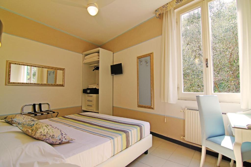 Postel nebo postele na pokoji v ubytování Hotel Souvenir