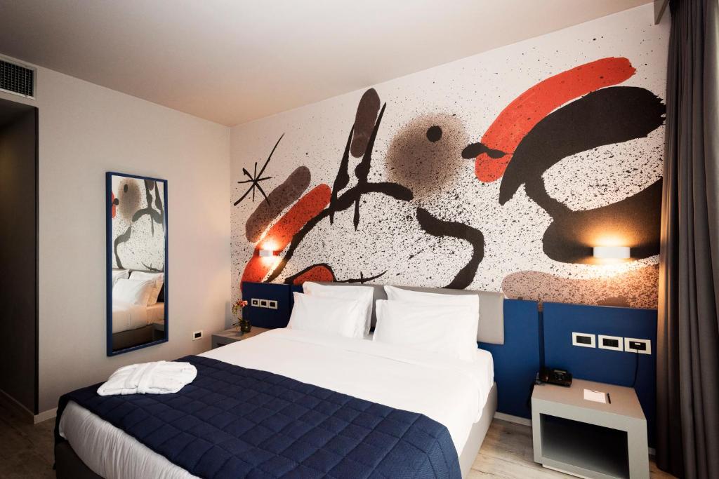 Postel nebo postele na pokoji v ubytování JR Hotels Gigli Firenze