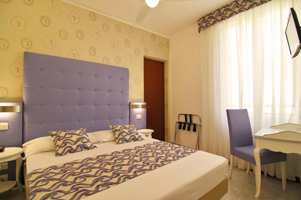 Postel nebo postele na pokoji v ubytování Hotel Souvenir
