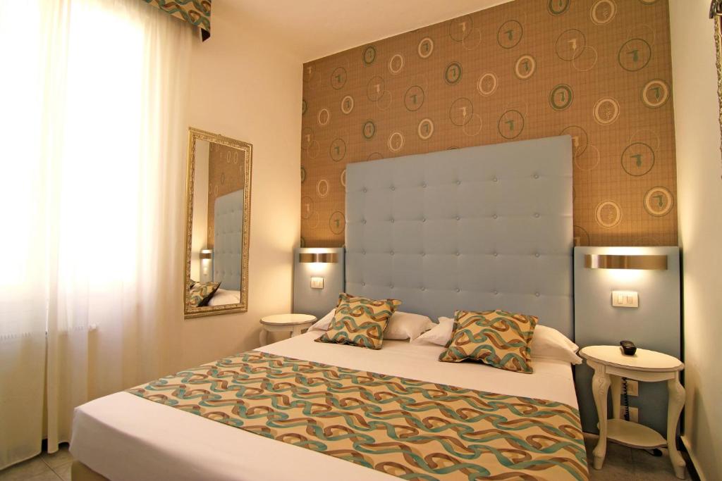 Postel nebo postele na pokoji v ubytování Hotel Souvenir