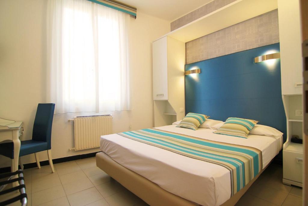 Postel nebo postele na pokoji v ubytování Hotel Souvenir