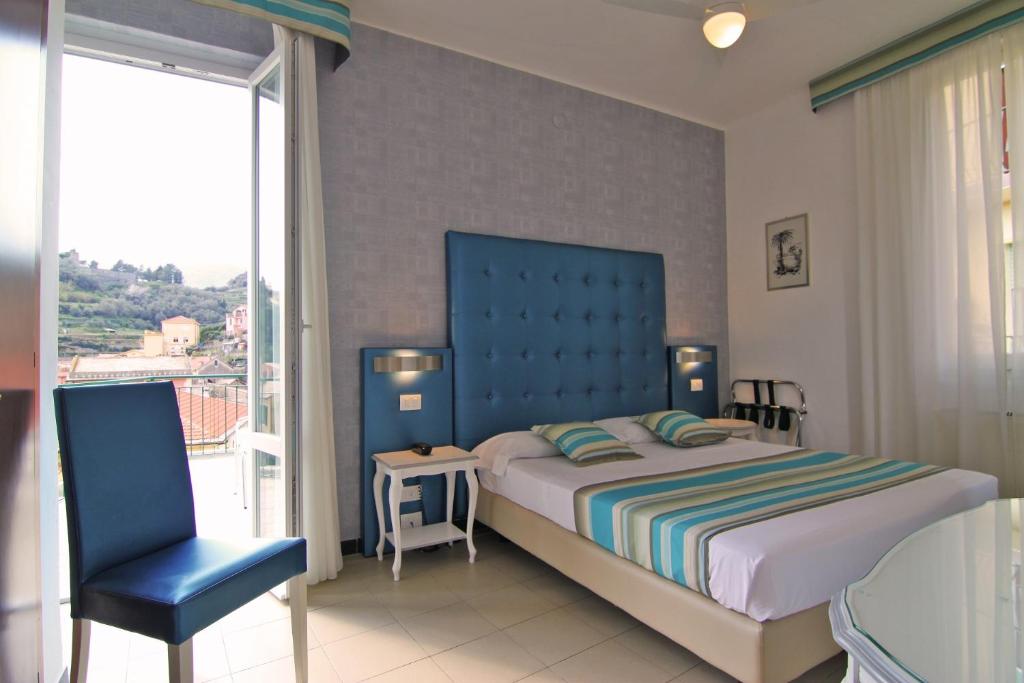 Postel nebo postele na pokoji v ubytování Hotel Souvenir
