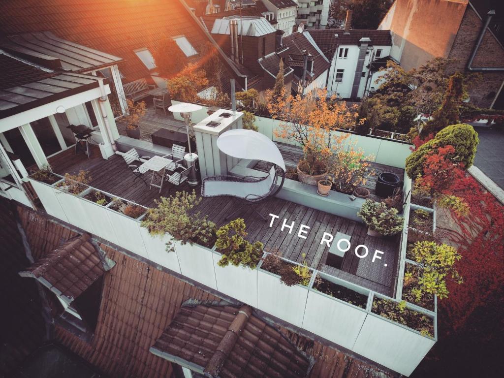 an overhead view of the roof of a building with plants at Rooftop Penthouse Karlsruhe in Karlsruhe