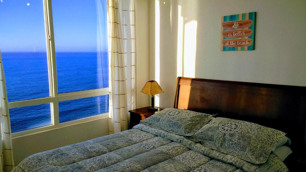 Ένα ή περισσότερα κρεβάτια σε δωμάτιο στο Quilén Apartment