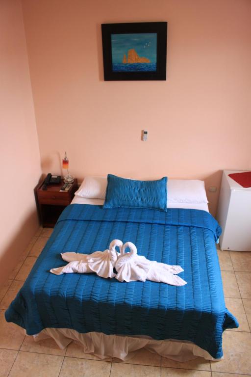 Postel nebo postele na pokoji v ubytování Hostal La Posada De Jose Carlos