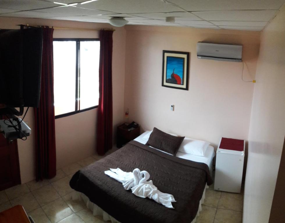 Postel nebo postele na pokoji v ubytování Hostal La Posada De Jose Carlos