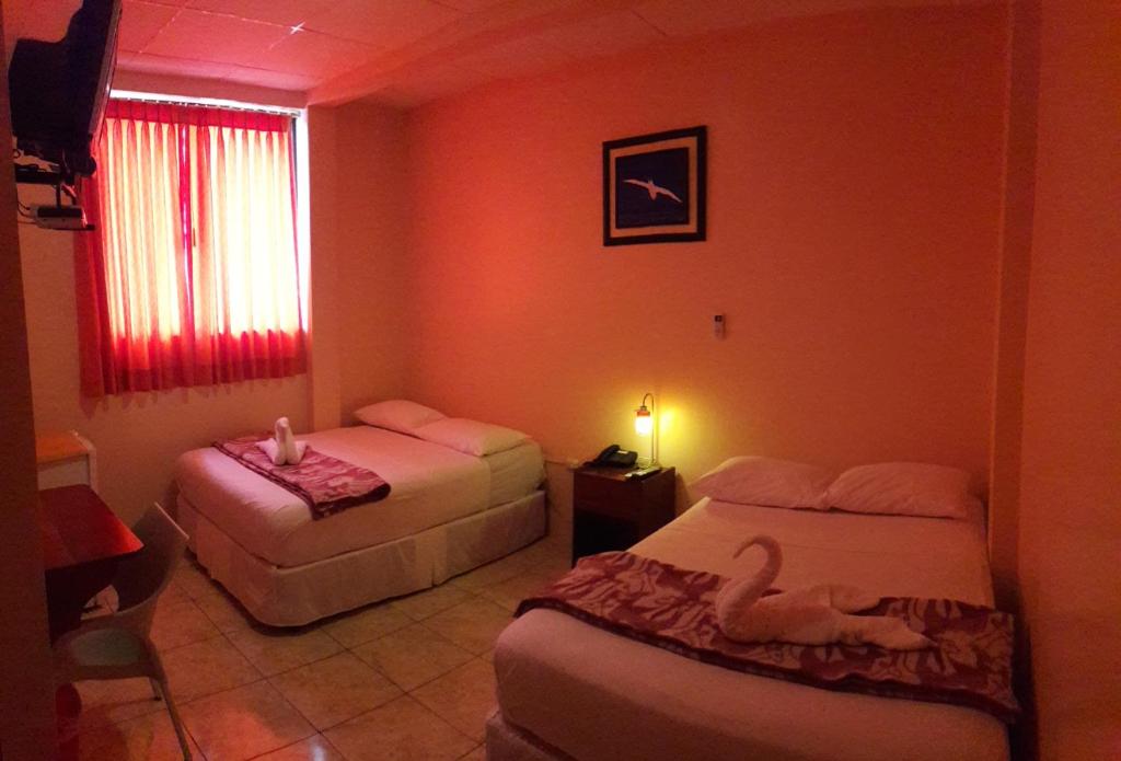 Postel nebo postele na pokoji v ubytování Hostal La Posada De Jose Carlos