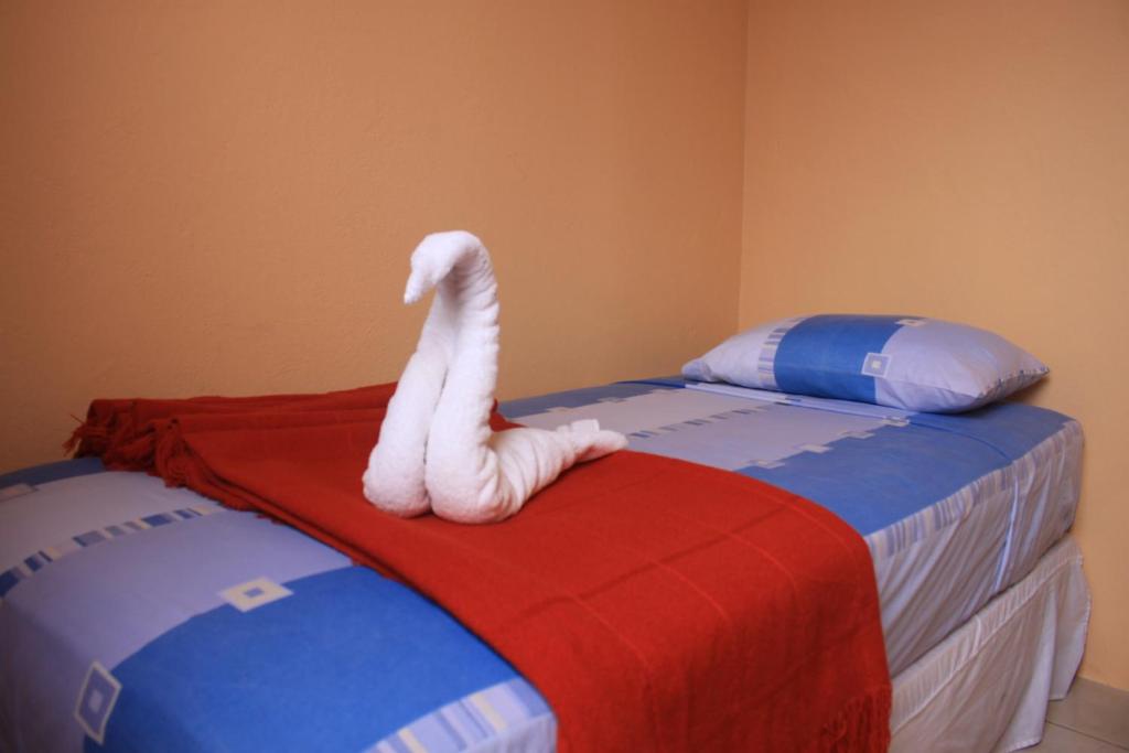 Postel nebo postele na pokoji v ubytování Hostal La Posada De Jose Carlos