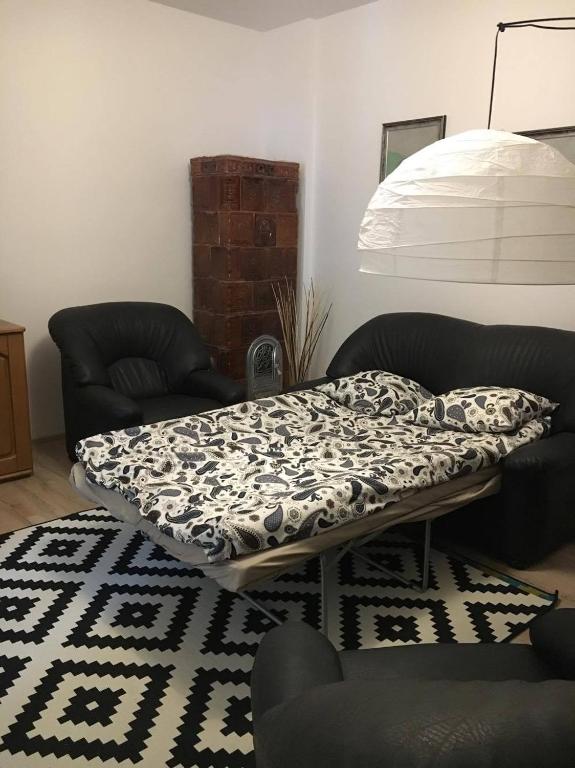 a bed sitting on a table in a living room at Casa Oprea in Sinaia