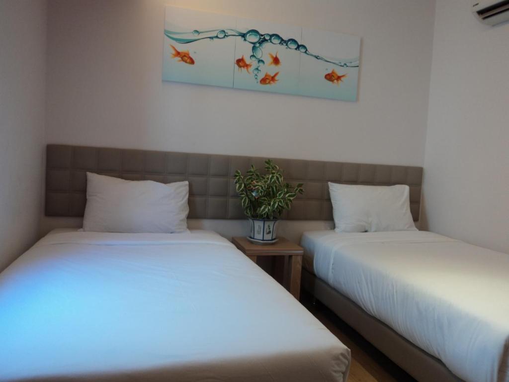 Postel nebo postele na pokoji v ubytování GM City Hotel