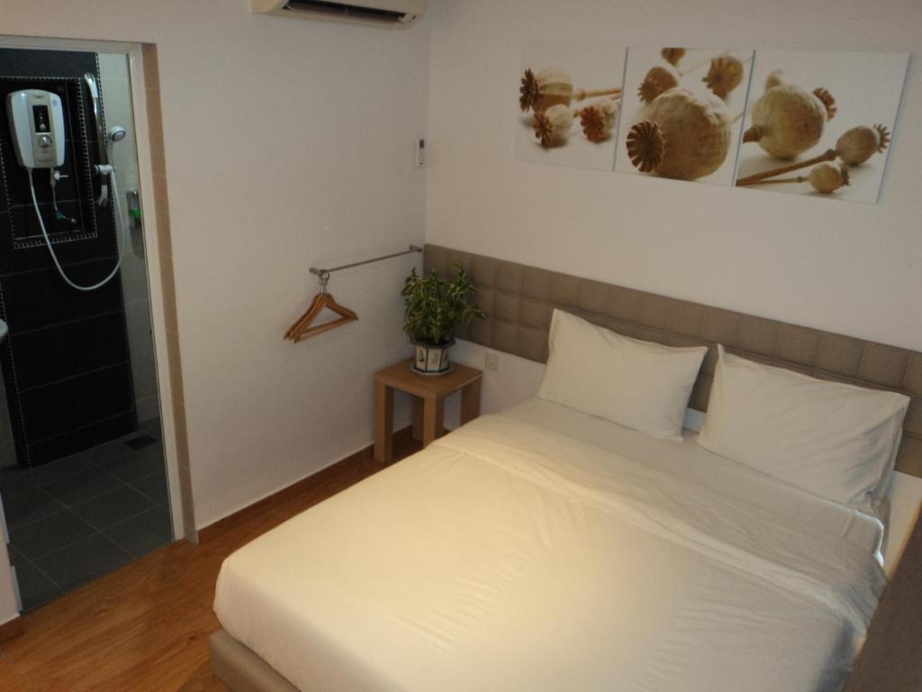 Postel nebo postele na pokoji v ubytování GM City Hotel