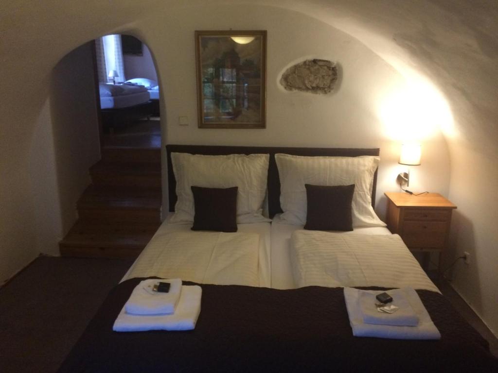 Postel nebo postele na pokoji v ubytování Hotel Klika