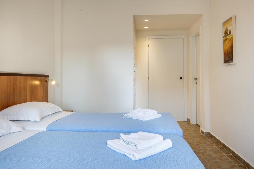 Postel nebo postele na pokoji v ubytování Marialena Hotel