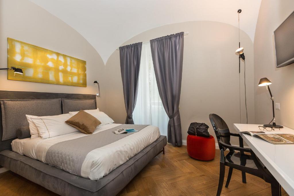 Posteľ alebo postele v izbe v ubytovaní Palazzo Baj in Trastevere