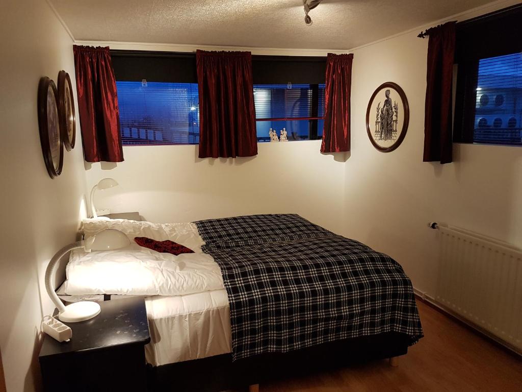 Postel nebo postele na pokoji v ubytování Holiday Guesthouse