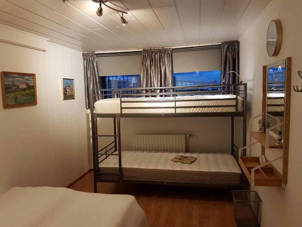 Postel nebo postele na pokoji v ubytování Holiday Guesthouse