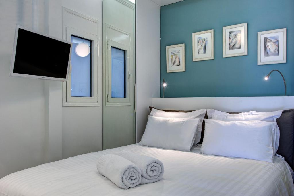 Posteľ alebo postele v izbe v ubytovaní Frixos Acropolis Luxury Apartment