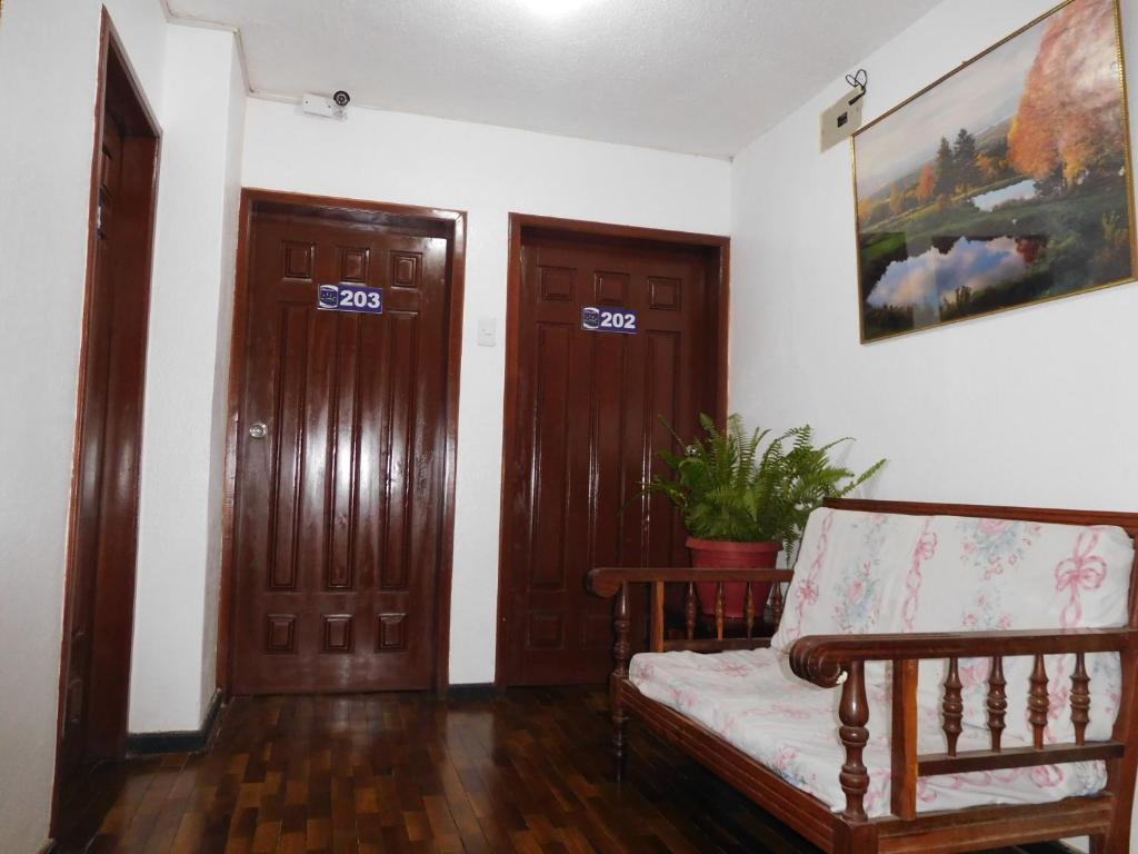 Postel nebo postele na pokoji v ubytování Hostal Alborada Riobamba