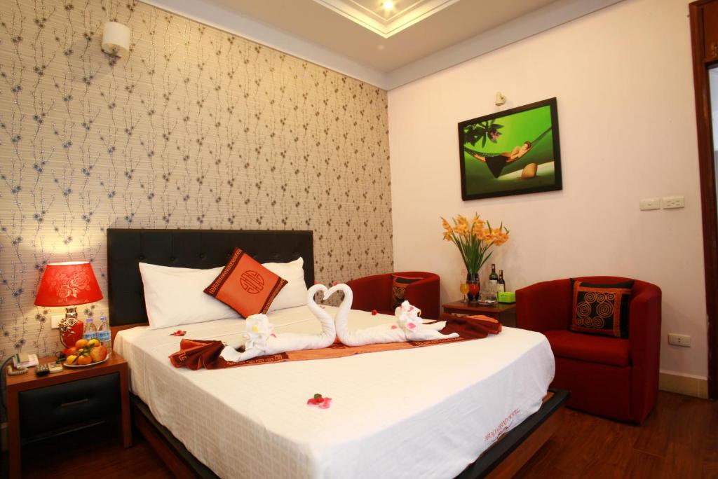Postel nebo postele na pokoji v ubytování Urban Alley Hotel
