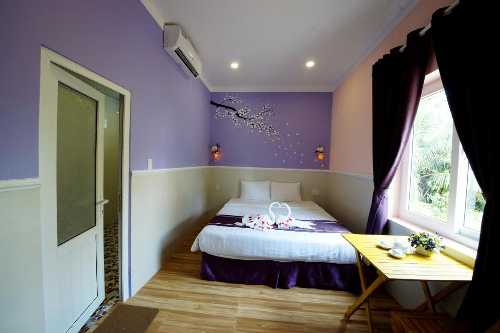 Postel nebo postele na pokoji v ubytování Q Songchi Hotel
