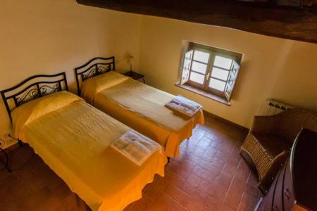 Postel nebo postele na pokoji v ubytování Frantoio di Corsanico