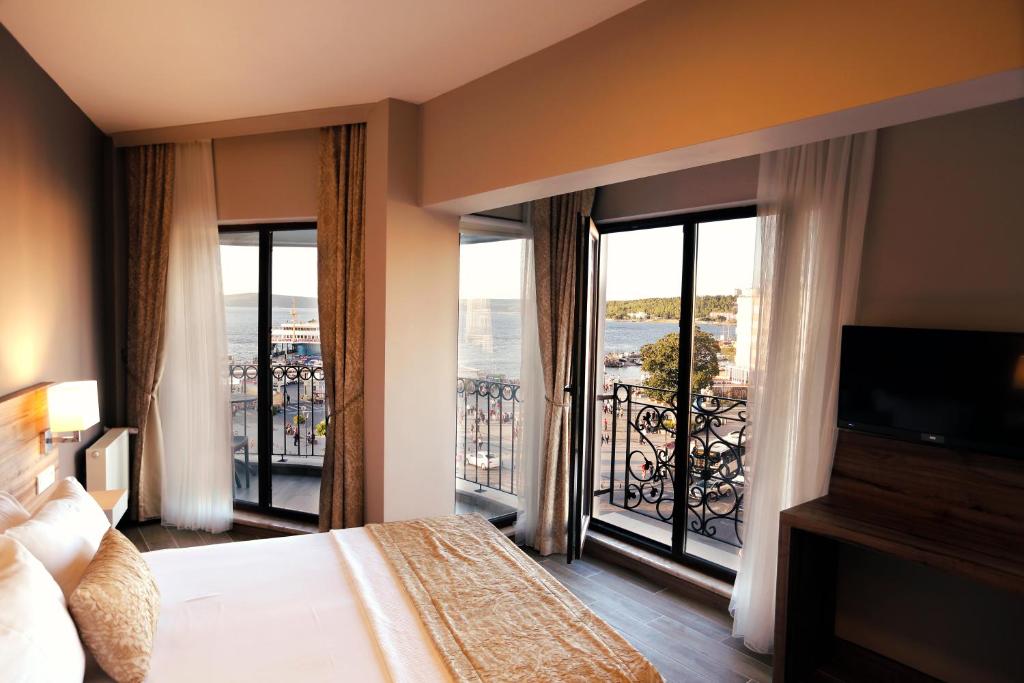 Postel nebo postele na pokoji v ubytování Kule Hotel