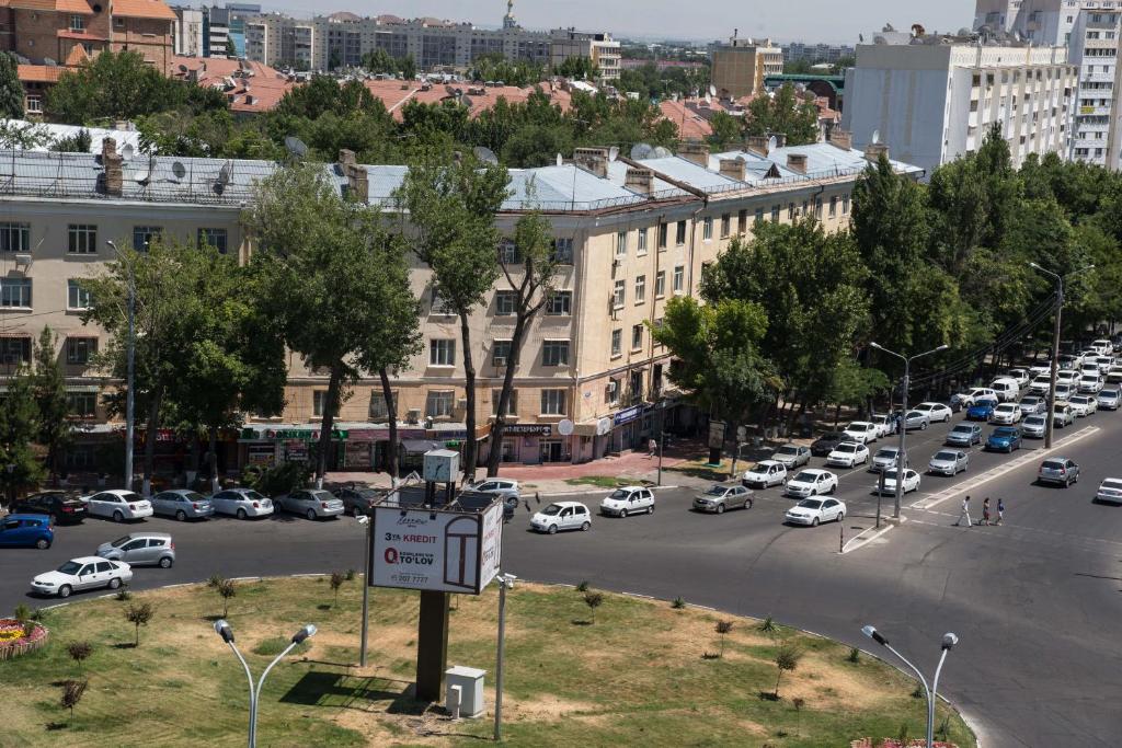 a busy city street with a lot of cars parked at Art Studio in Tashkent