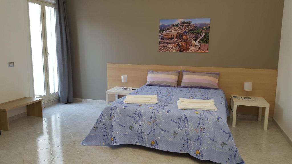 Postel nebo postele na pokoji v ubytování Ragusa Terra Priziusa