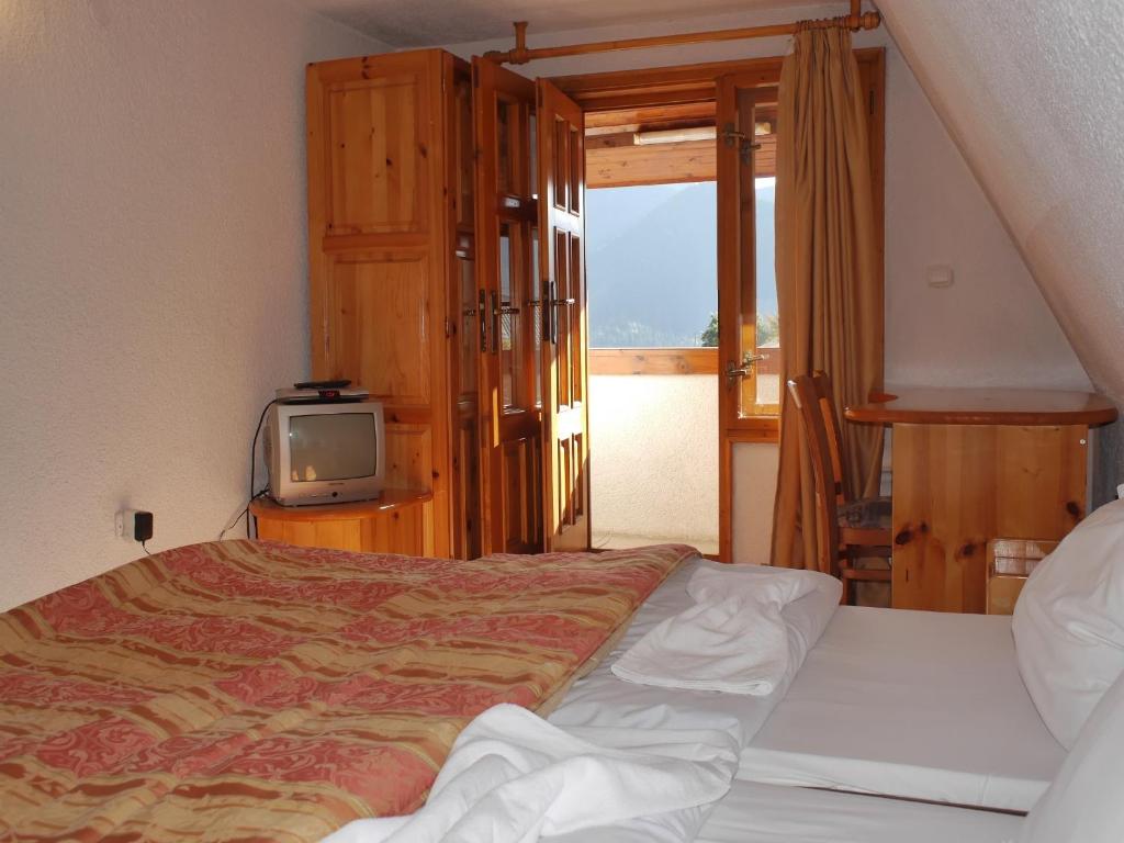 Postel nebo postele na pokoji v ubytování Family Hotel Silver