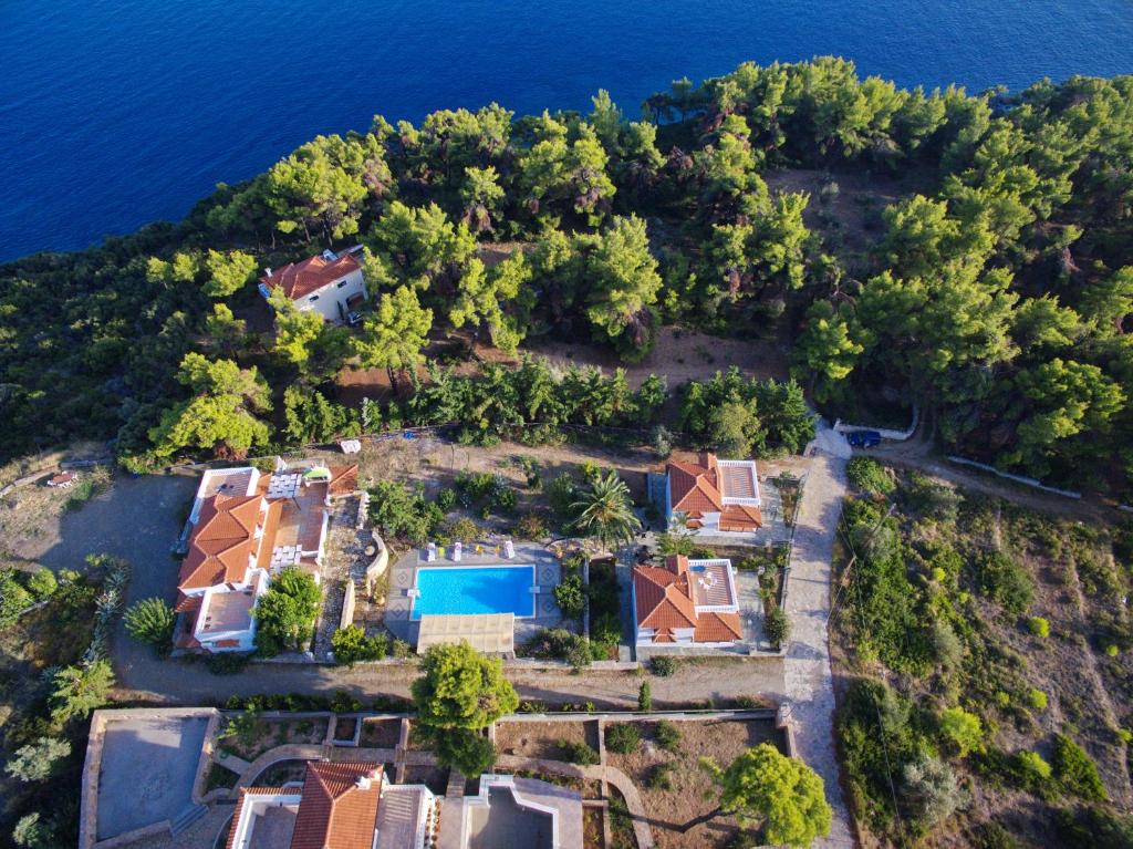 an aerial view of a house on an island in the water at Kamelia Villas in Votsi
