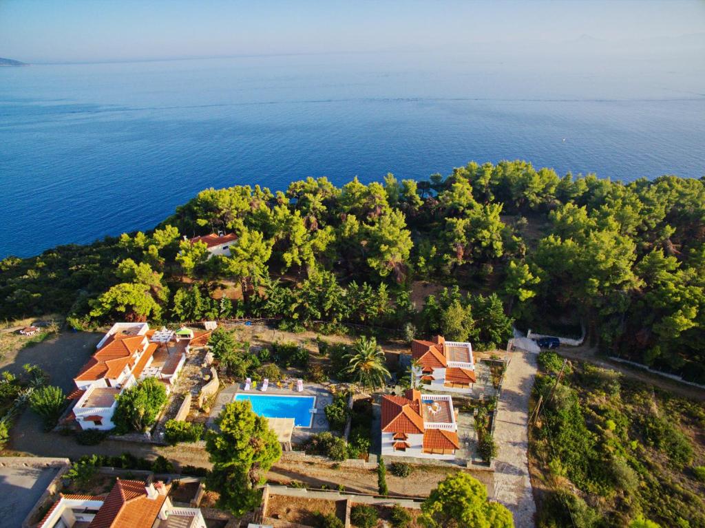 an aerial view of a resort and the ocean at Kamelia Villas in Votsi