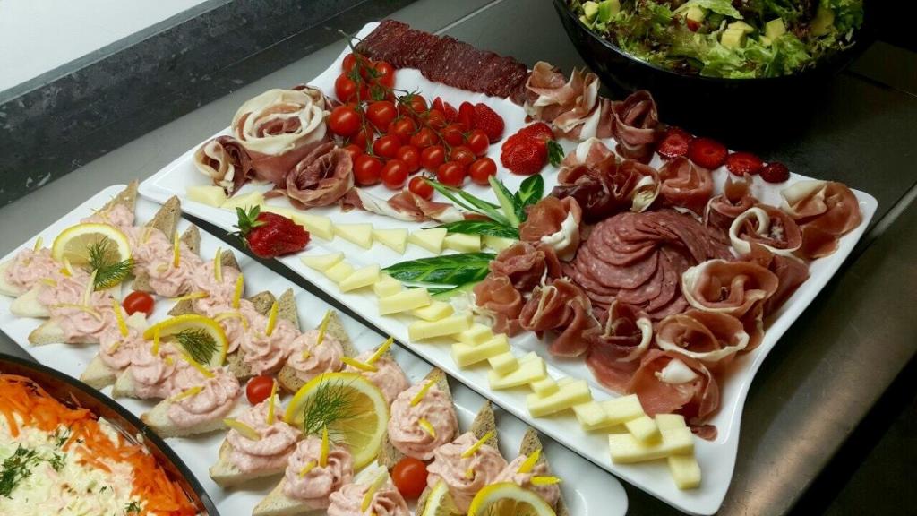 a tray of different types of food on a table at Arena Mar Hotel and SPA in Golden Sands